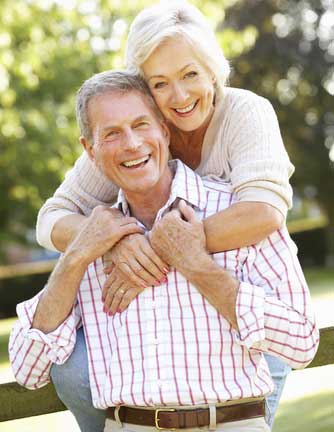 happy senior couple hugging
