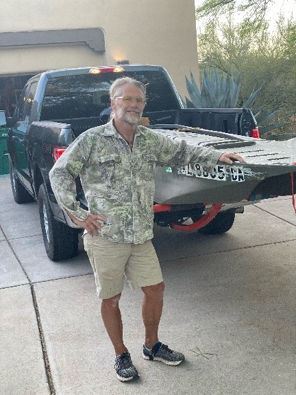 Dr Gerhauser standing by a car