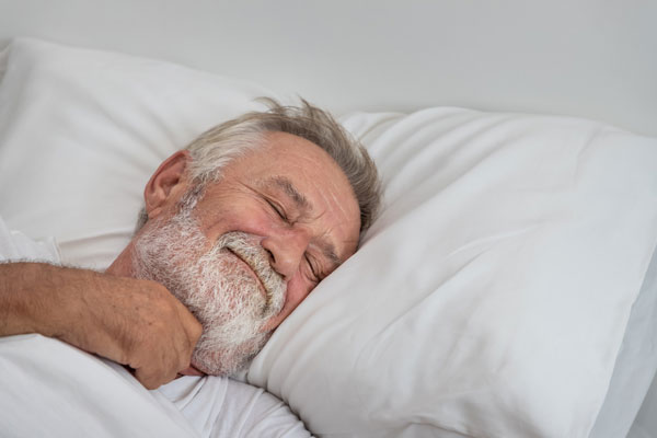 Man sleeping and smiling